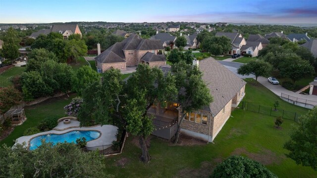 128 Big Sky Cv, Austin, TX 78737 - aerial view at dusk of a residential view and view of pool