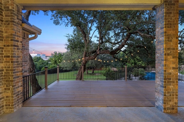 128 Big Sky Cv, Austin, TX 78737 - patio terrace at dusk featuring a deck