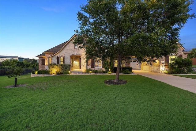 128 Big Sky Cv, Austin, TX 78737 - view of front of home featuring stone siding, driveway, and a front lawn