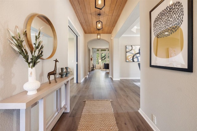 128 Big Sky Cv, Austin, TX 78737 - corridor with wood ceiling, arched walkways, and dark wood-style flooring