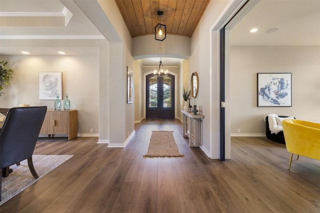 128 Big Sky Cv, Austin, TX 78737 - foyer entrance featuring arched walkways, french doors, dark wood-style flooring, crown molding, and wood ceiling