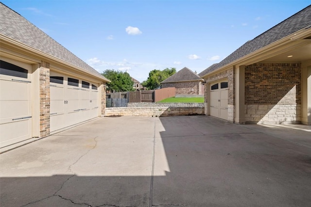 128 Big Sky Cv, Austin, TX 78737 - view of patio with a garage and driveway