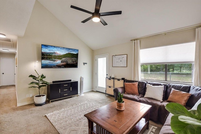 902 Linden St, Bastrop, TX 78602 - living room with light colored carpet, ceiling fan, and high vaulted ceiling
