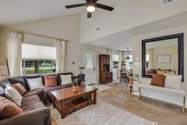 902 Linden St, Bastrop, TX 78602 - living area featuring light colored carpet, ceiling fan, and high vaulted ceiling