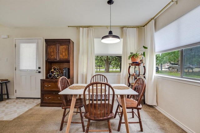 902 Linden St, Bastrop, TX 78602 - dining space with baseboards and light colored carpet