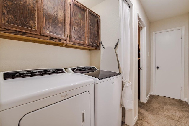 902 Linden St, Bastrop, TX 78602 - laundry area featuring independent washer and dryer, light colored carpet, and cabinet space