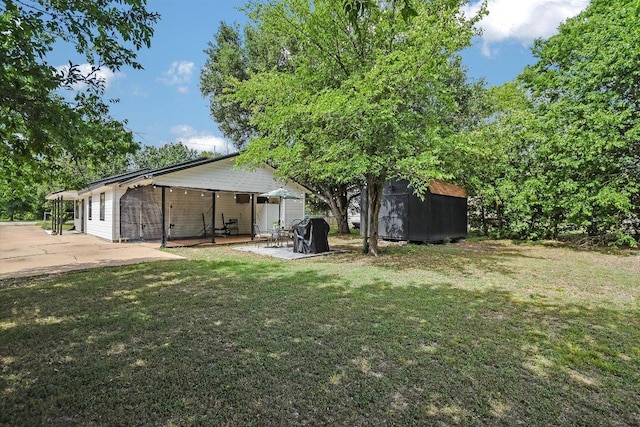 902 Linden St, Bastrop, TX 78602 - view of green lawn featuring a shed and a patio