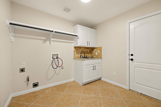 3608 Rockefeller Cv, Lago Vista, TX 78645 - washroom featuring hookup for an electric dryer, hookup for a washing machine, hookup for a gas dryer, cabinet space, and light tile patterned floors