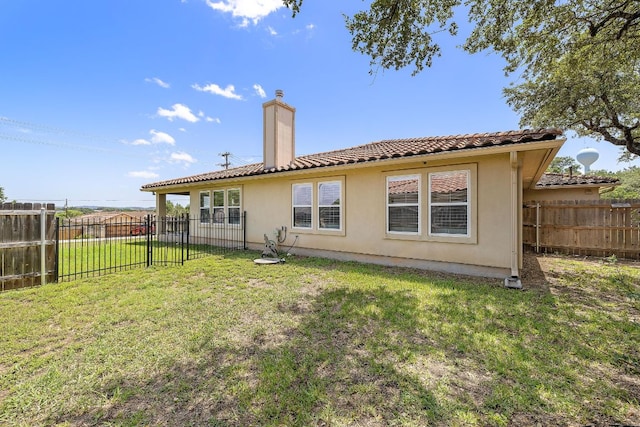 3608 Rockefeller Cv, Lago Vista, TX 78645 - back of property with a tile roof, a fenced backyard, and stucco siding