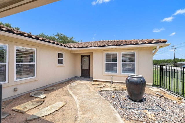 3608 Rockefeller Cv, Lago Vista, TX 78645 - entrance to property featuring a tile roof and stucco siding