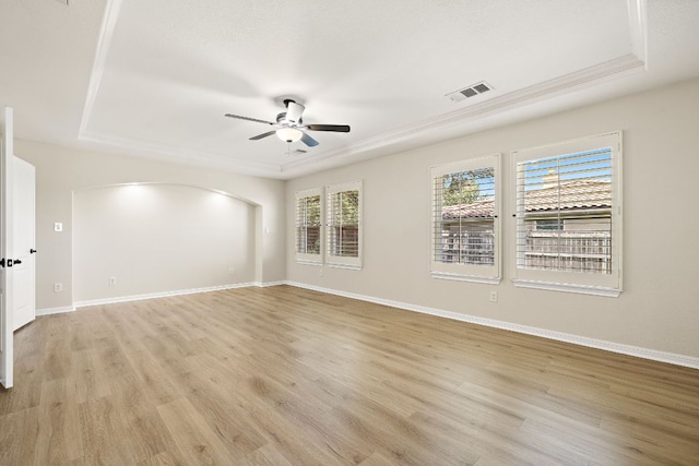 3608 Rockefeller Cv, Lago Vista, TX 78645 - unfurnished room with a raised ceiling, ceiling fan, and light wood-style flooring
