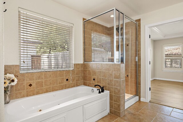 3608 Rockefeller Cv, Lago Vista, TX 78645 - bathroom featuring a whirlpool tub and a shower stall