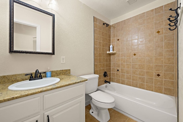 3608 Rockefeller Cv, Lago Vista, TX 78645 - full bath with vanity, washtub / shower combination, a textured wall, and tile patterned flooring