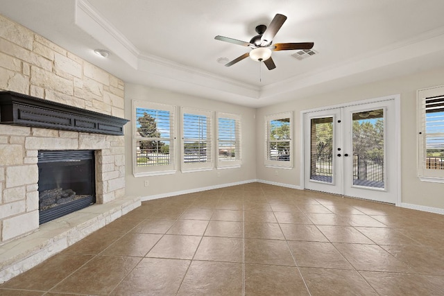 3608 Rockefeller Cv, Lago Vista, TX 78645 - unfurnished living room with a raised ceiling, crown molding, a ceiling fan, tile patterned flooring, and french doors