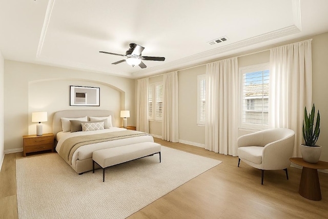 3608 Rockefeller Cv, Lago Vista, TX 78645 - bedroom with light wood finished floors, a ceiling fan, and ornamental molding