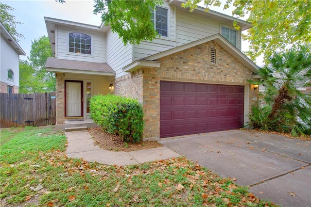 2306 Wilma Rudolph Rd, Austin, TX 78748 - traditional-style home featuring a garage, concrete driveway, and brick siding