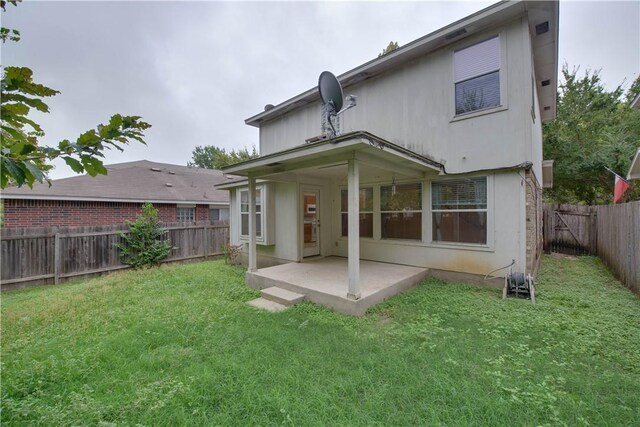 2306 Wilma Rudolph Rd, Austin, TX 78748 - rear view of property featuring a patio area and a fenced backyard