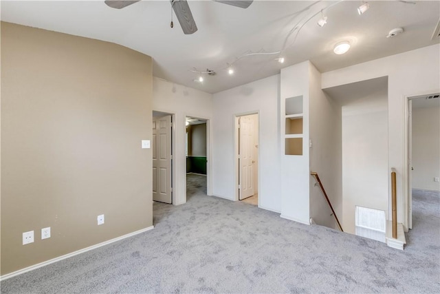 2306 Wilma Rudolph Rd, Austin, TX 78748 - unfurnished bedroom with carpet flooring, track lighting, and lofted ceiling