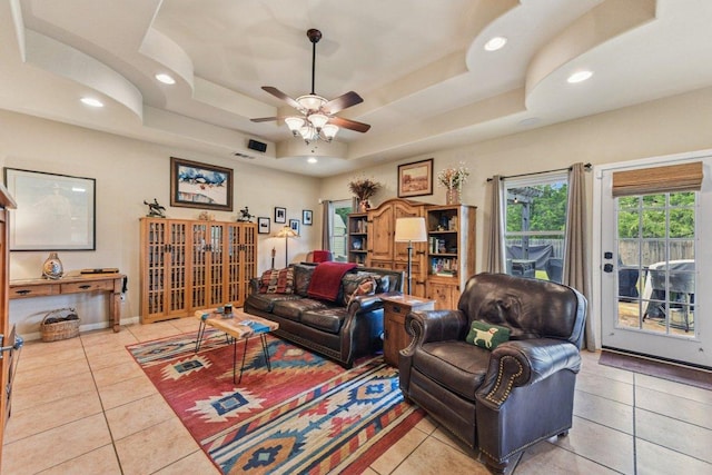 157 Old Firetower Rd, Bastrop, TX 78602 - living area with a tray ceiling, light tile patterned flooring, a ceiling fan, and recessed lighting