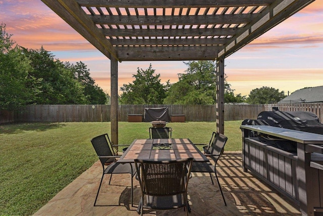 157 Old Firetower Rd, Bastrop, TX 78602 - patio terrace at dusk with a fenced backyard, outdoor dining area, a pergola, and a patio