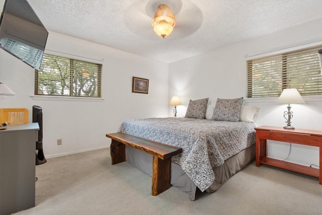 4001 Granada Dr, Georgetown, TX 78628 - carpeted bedroom featuring a textured ceiling and ceiling fan