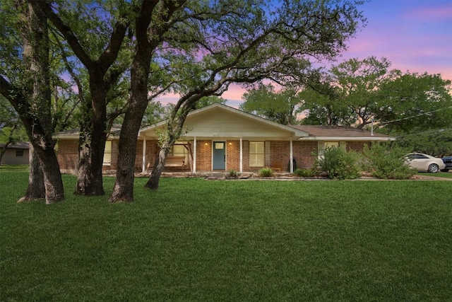 4001 Granada Dr, Georgetown, TX 78628 - single story home with a front lawn and brick siding