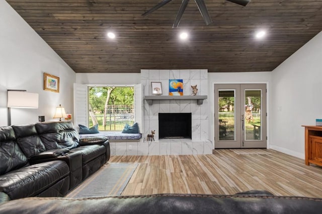 4001 Granada Dr, Georgetown, TX 78628 - living room with vaulted ceiling, wooden ceiling, wood finished floors, a fireplace, and recessed lighting