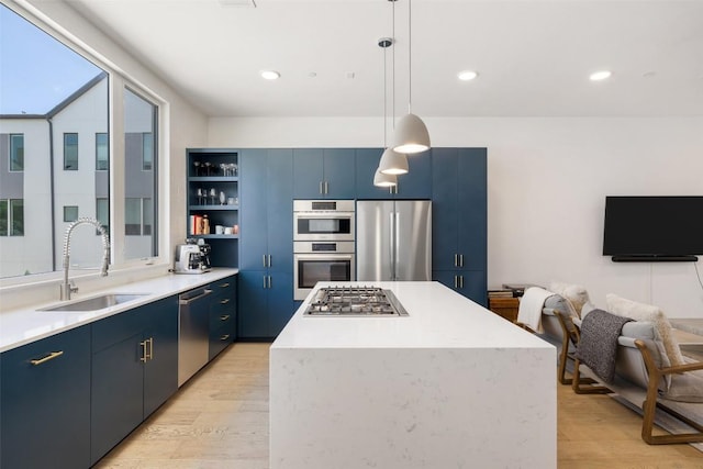 3100 Menchaca Rd Unit 24, Austin, TX 78704 - kitchen featuring stainless steel appliances, blue cabinetry, open shelves, light wood-style flooring, and recessed lighting