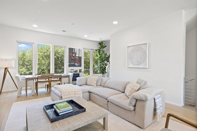 3100 Menchaca Rd Unit 24, Austin, TX 78704 - living room featuring light wood-style floors and recessed lighting