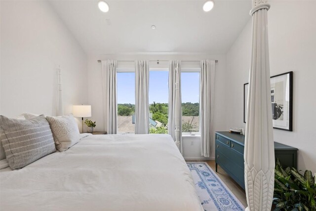3100 Menchaca Rd Unit 24, Austin, TX 78704 - bedroom featuring vaulted ceiling, light wood-style flooring, and recessed lighting