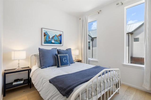 3100 Menchaca Rd Unit 24, Austin, TX 78704 - bedroom with wood finished floors and baseboards