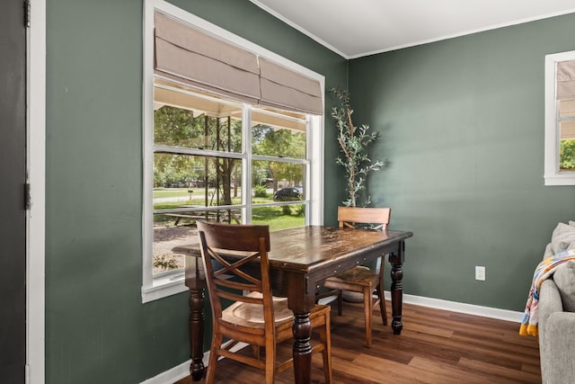 1215 Bois Darc St, Lockhart, TX 78644 - dining room with healthy amount of natural light, wood finished floors, and ornamental molding