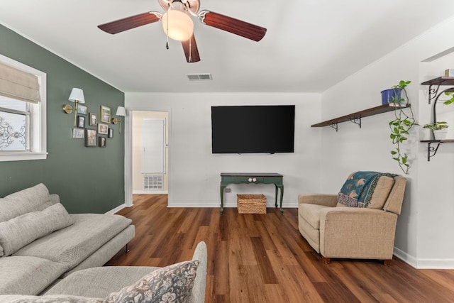 1215 Bois Darc St, Lockhart, TX 78644 - living area featuring wood finished floors and a ceiling fan