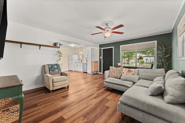 1215 Bois Darc St, Lockhart, TX 78644 - living area with ceiling fan and wood finished floors