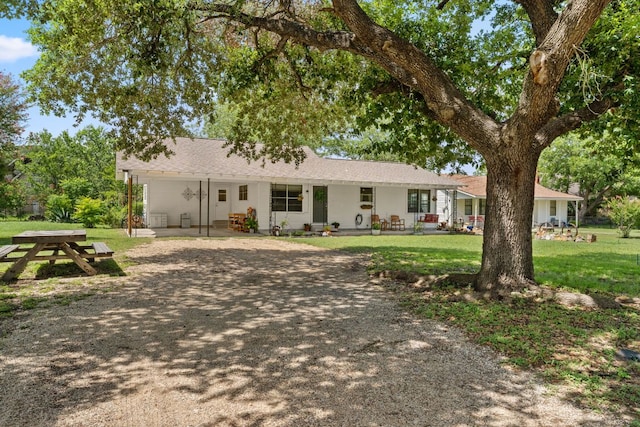 1215 Bois Darc St, Lockhart, TX 78644 - single story home with a front lawn