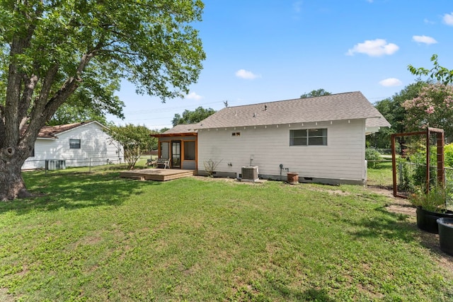 1215 Bois Darc St, Lockhart, TX 78644 - back of property featuring a deck