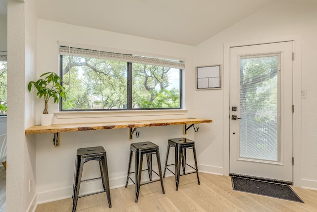 6904 Rusty Fig Dr, Austin, TX 78750 - entryway featuring light wood-style flooring, plenty of natural light, and vaulted ceiling