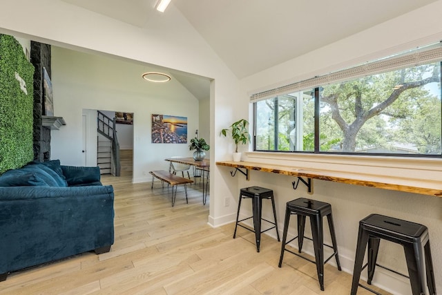 6904 Rusty Fig Dr, Austin, TX 78750 - living area with stairs, light wood finished floors, and high vaulted ceiling
