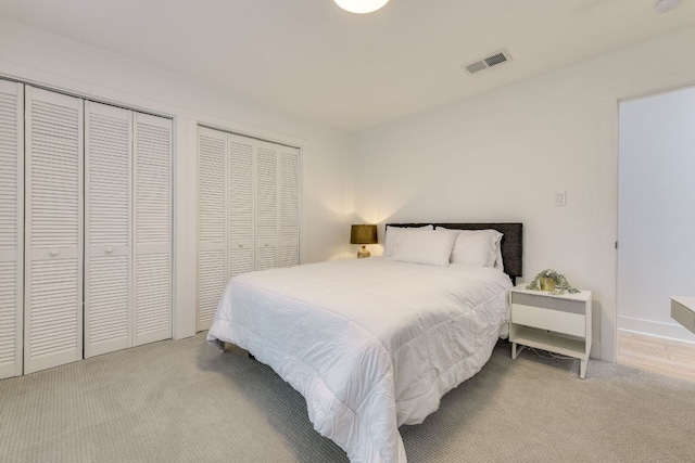 6904 Rusty Fig Dr, Austin, TX 78750 - bedroom featuring carpet and two closets