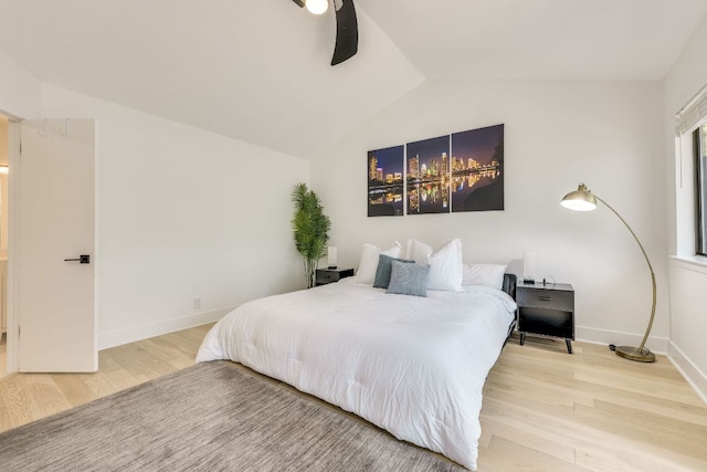6904 Rusty Fig Dr, Austin, TX 78750 - bedroom featuring vaulted ceiling, wood finished floors, and a ceiling fan