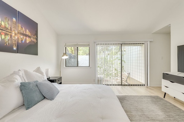 6904 Rusty Fig Dr, Austin, TX 78750 - bedroom with wood finished floors and lofted ceiling