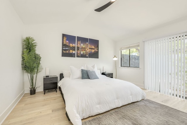 6904 Rusty Fig Dr, Austin, TX 78750 - bedroom featuring wood finished floors, vaulted ceiling, and a ceiling fan