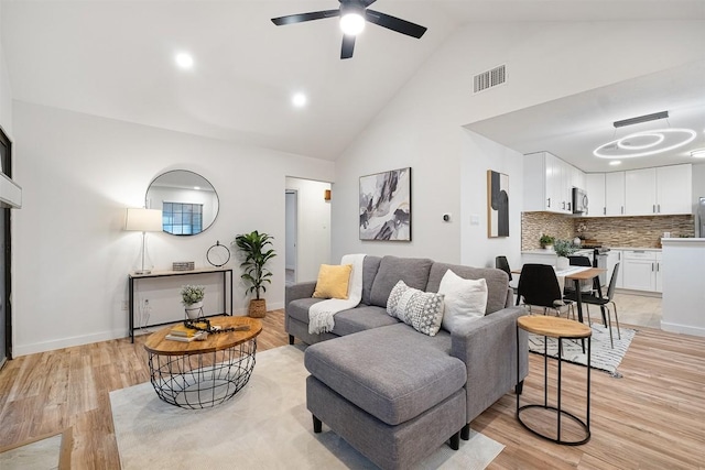 12307 Marogot Run, Austin, TX 78758 - living area with ceiling fan, high vaulted ceiling, light wood finished floors, and recessed lighting