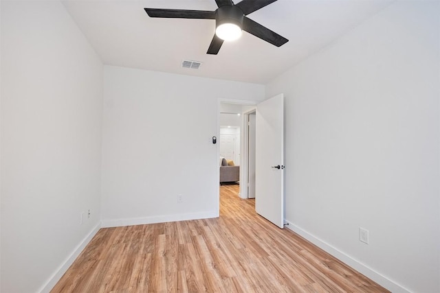 12307 Marogot Run, Austin, TX 78758 - empty room with light wood-style floors and a ceiling fan