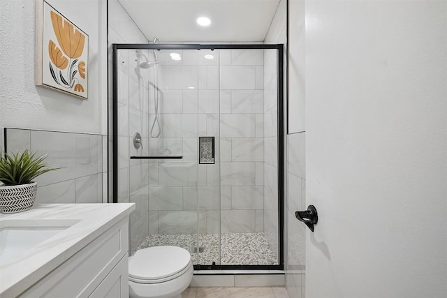 12307 Marogot Run, Austin, TX 78758 - bathroom featuring vanity, a stall shower, and recessed lighting