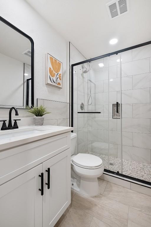 12307 Marogot Run, Austin, TX 78758 - full bathroom with a shower stall and vanity