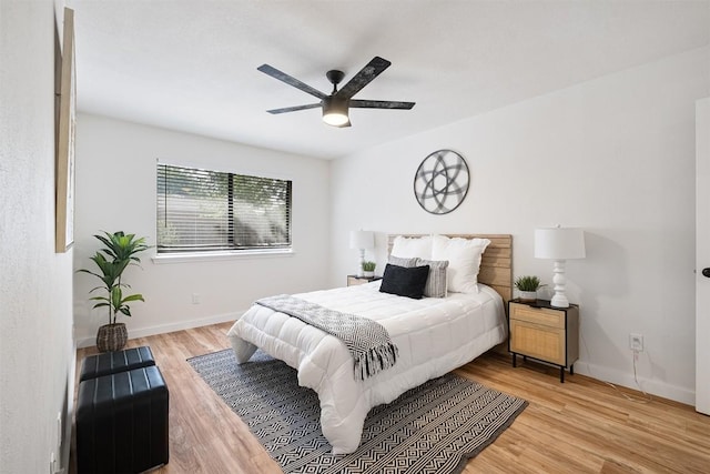 12307 Marogot Run, Austin, TX 78758 - bedroom featuring wood finished floors and a ceiling fan