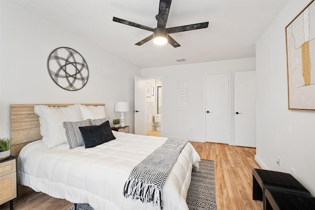 12307 Marogot Run, Austin, TX 78758 - bedroom featuring light wood-type flooring, ceiling fan, and ensuite bathroom