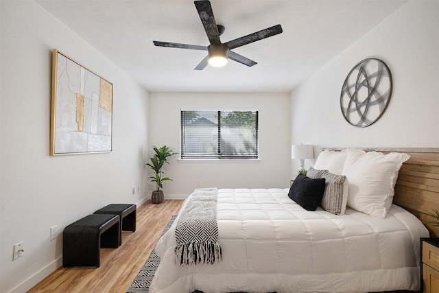 12307 Marogot Run, Austin, TX 78758 - bedroom with light wood-style flooring and a ceiling fan