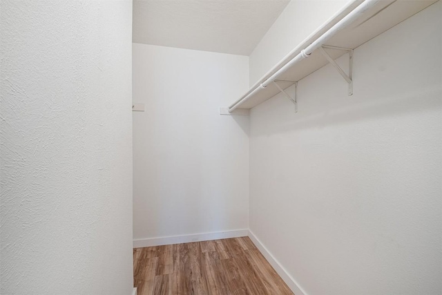 12307 Marogot Run, Austin, TX 78758 - spacious closet featuring wood finished floors